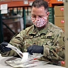 Washington National Guard members build COVID-19 test kits